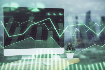 Stock market graph and table with computer background. Double exposure. Concept of financial analysis.