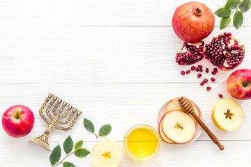 Jewish cuisine for rosh hashana holiday - apple honey and pomegranate, top view