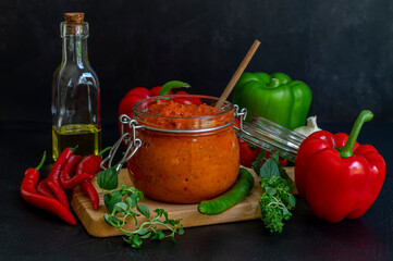 Selective focus of Serbian Roasted Red Pepper Sauce Ajvar. Traditional autumn Balkan relish.