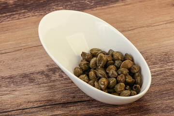 Tasty capers in the bowl