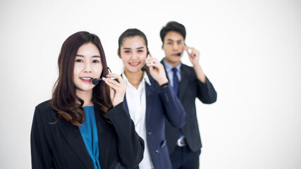 Young Asian business call center man and woman with headset ready to work for customer support. people smile with positive attitude. Consulting and assistance service concept background