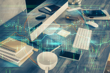Double exposure of forex graph and work space with computer. Concept of international online trading.