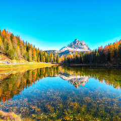 Stunning view of popular travel destination mountain lake Antorno in autumn
