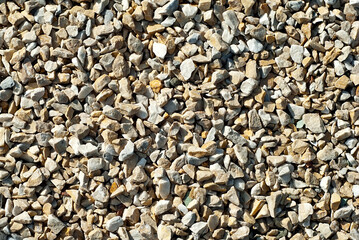 Drainage systems from small pebbles. Garden drainage for plants and trees. Yellow stones for roads and flower beds.