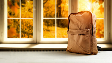 Autumn window and backpack of free space 