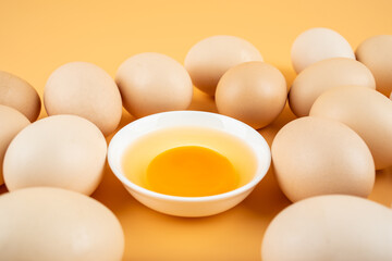 A pile of eggs on a yellow background