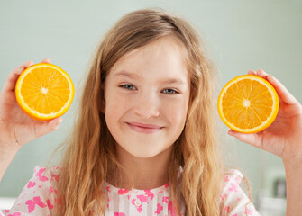 Cheerful girl with orange
