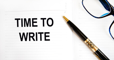 The inscription on a sheet of paper attached to the tablet for the letter TIME TO WRITE, next to the calculator, graziki and other stationery.