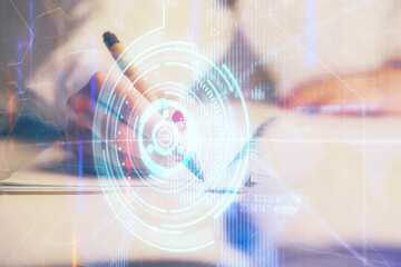 Multi exposure of woman's writing hand on background with data technology hologram. Concept of innovation.