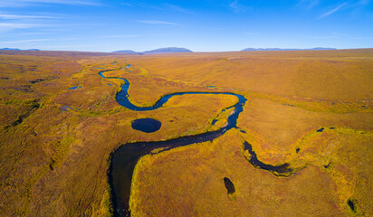 Aerial view of the tundra of the North slope in Alaska in autumn - obrazy, fototapety, plakaty