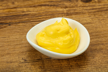 Natural cheese sauce in the bowl