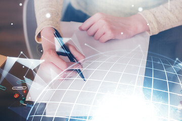 Multi exposure of hands making notes with world map hologram and data theme icons. Concept of global computer data.