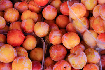 Yellow plum food background top view