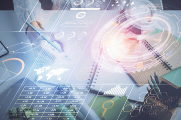 Double exposure of hands making notes background with technology and digital coding huds. Data learning concept.
