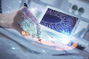 Double exposure of hands making notes with digital coding icons. Computer learning concept.