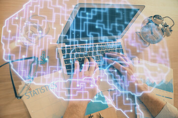 Man typing on keyboard background with brain hologram. Concept of big Data.