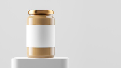Big tall transparent glass jar with copper metal cap and blank label filled by nut butter on the podium over white background.