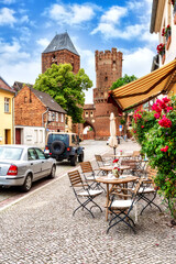 Neustädter Tor in the old town of Tangermünde with chairs and table in foreground