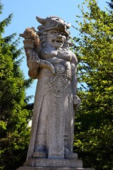 Fototapeta premium photograph of one of the depictions of the pagan god Radegast on a tourist route along the ridges of the Beskydy Mountains, Moravia, Czech Republic
