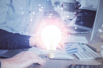 Growing arrows with businessman working on computer on background. Success concept. Double exposure.