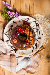 homemade cake decorated with cherries and chocolate glaze