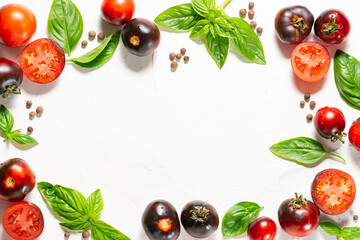 Creative layout made with ripe tomatoes,fresh aromatic basil and allspice on white stone background. Cooking book cover template.