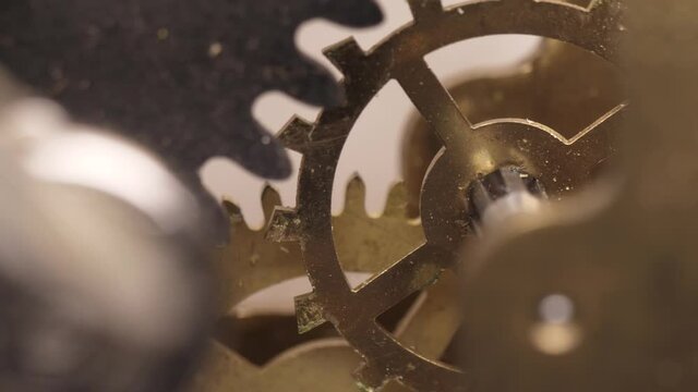 old clock mechanism with metal gears macro shot slow motion 4k