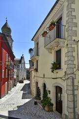 A narrow street among the old houses of Santa Croce del Sannio, a medieval village in the Campania region.
