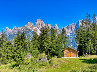 Fototapeta na wymiar Beautiful wooden hut in the alps