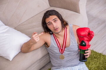Male ex-champion boxer suffering from alcoholism at home