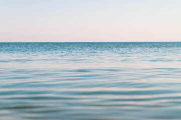 Obraz premium Blue calm sea. Seascape. A smooth sea without waves.