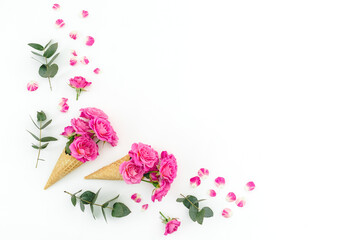 Floral composition with pink roses and eucalyptus on white background. Flat lay