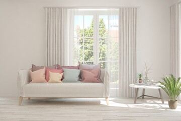 White living room with sofa and summer landscape in window. Scandinavian interior design. 3D illustration
