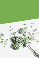 Modern food still life composition with frozen green pea vegetable. Concept of healthy eating