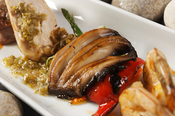 Premium Angus Beef Filet Mignon and Supreme chicken, shrimp and Portobello mushrooms.