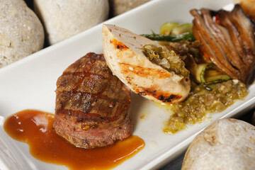 Premium Angus Beef Filet Mignon and Supreme chicken, shrimp and Portobello mushrooms.