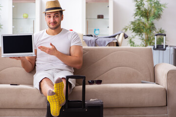 Young man preparing for departure at home