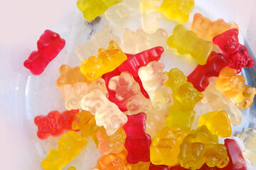 many colorful gelatinous sweets, gummy bear, concept of children's delicacy, healthy and unhealthy...