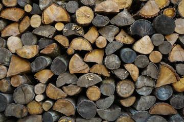 Pile of wood logs ready for winter. Wood logs texture background