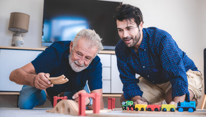 Obraz premium Portrait of happy smiling senior father at home, senior man in family concept