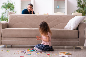 Young father and little girl indoors