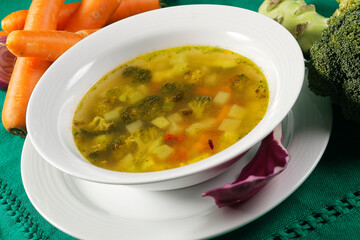 Typical peasant chicken broth soup with broccoli and carrots.