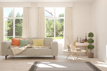 White living room with sofa and summer landscape in window. Scandinavian interior design. 3D illustration