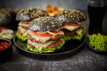 Delicious black hamburger with patties and cheese