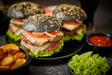 Delicious black hamburger with patties and cheese