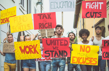 Public demonstration on the street against social problems and human rights. Group of multiethnic...