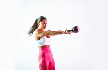 Woman training with dumbbells in the gym