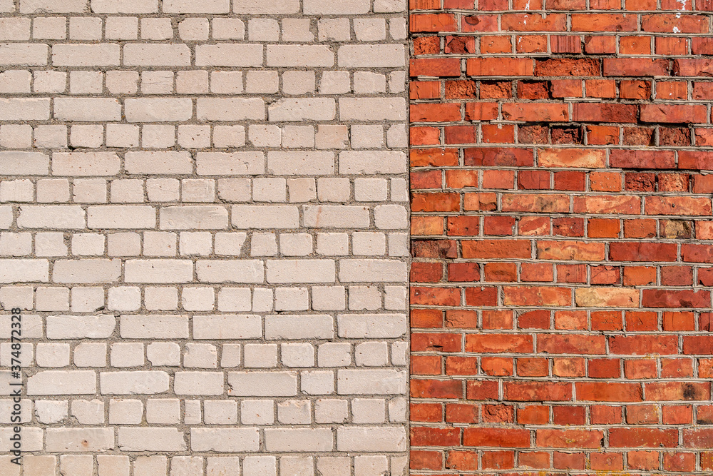 Wall mural Brick wall full frame with two sections of different colours