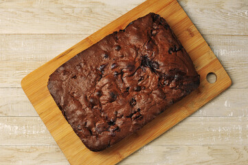 chocolate brownie pie top view on a wooden background
