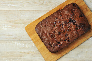 chocolate brownie pie top view on a wooden background